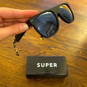 RETROSUPERFUTURE Sunglasses with tortoise shell and tinted blue lenses